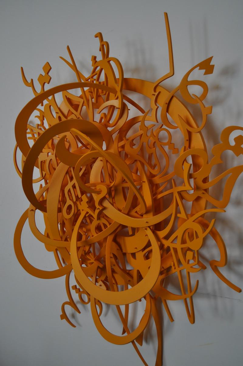 Orange resin casting of tangled words
